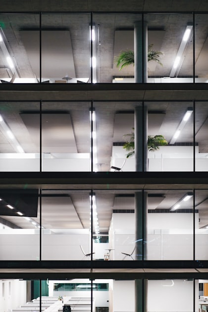 Modern office building at night with clean, lit interiors